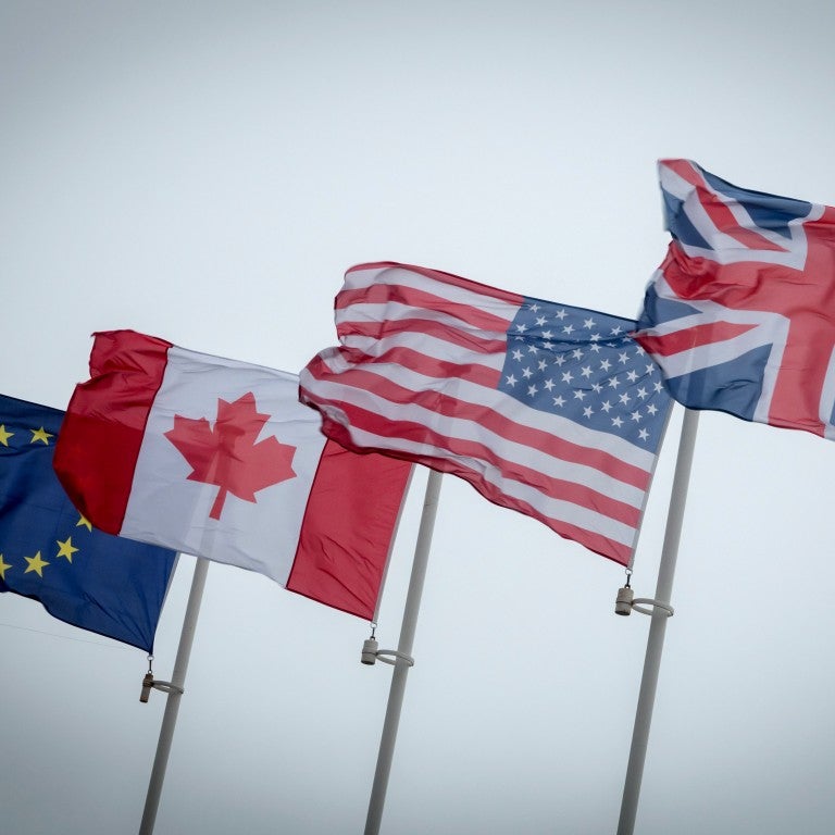 Flags of the EU, Canada, the U.S., and the UK